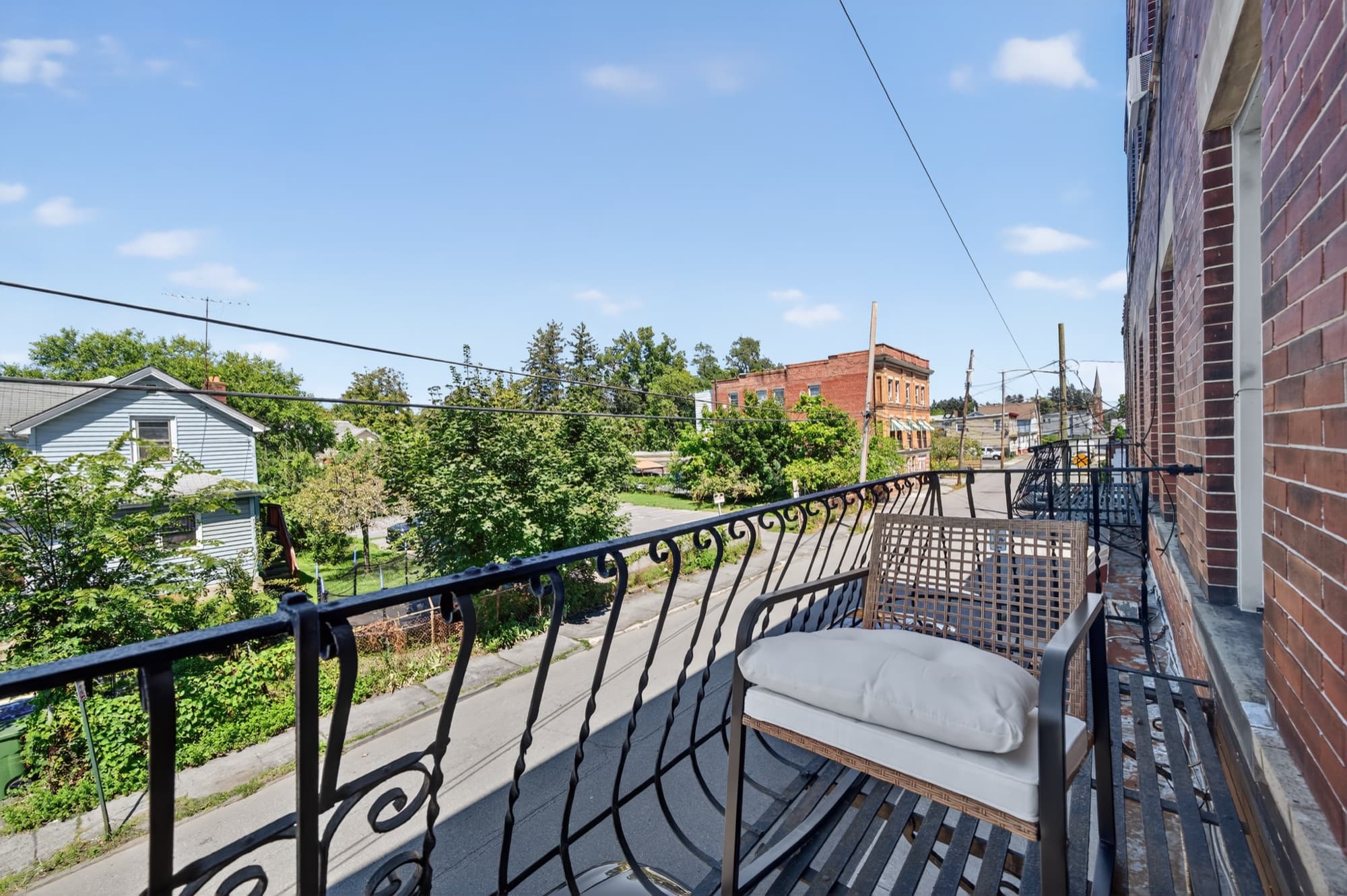 The wrought-iron balcony over Cottage Street