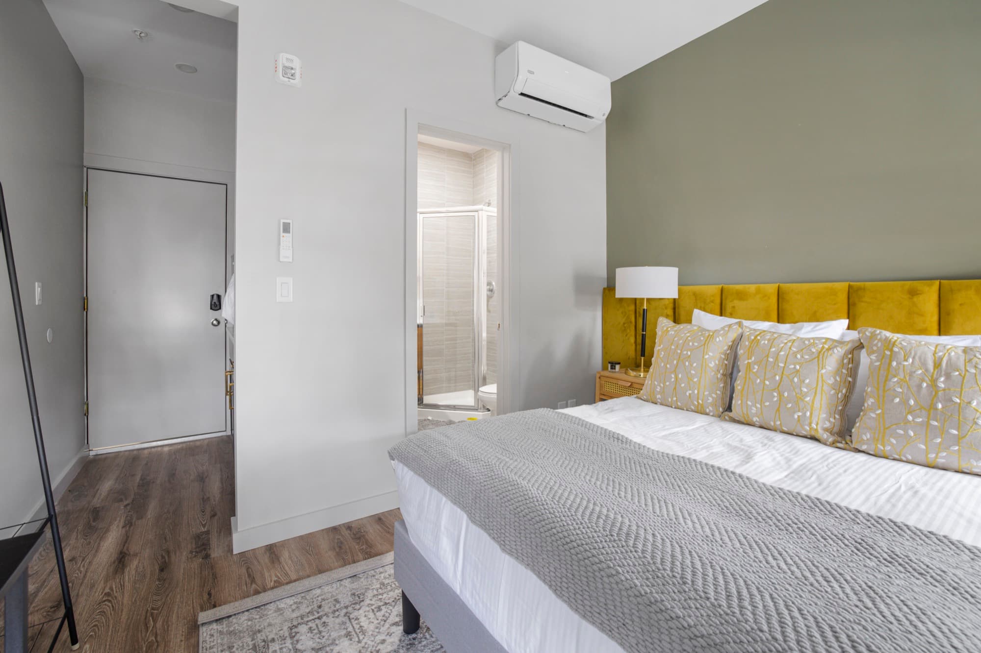 Bedroom from another angle with a workspace and bath access